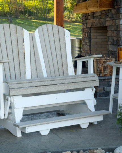 4 foot Adirondack Poly Balcony Glider Birch and White on patio with fireplace.