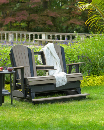 LuxCraft 5 foot balcony glider coastal gray and black with deluxe end table in back yard.