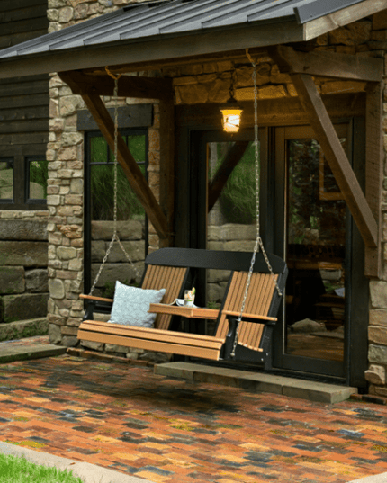 5 foot classic poly swing cedar black on Stone house