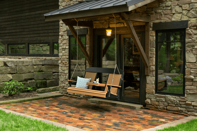 5 foot classic poly swing cedar black on Stone house