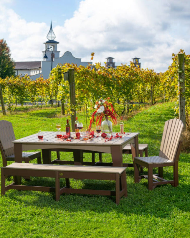 LuxCraft Island Dining table 44 x 72 Rectangular featured in weatherwood and chestnut brown with Adirondack side chair and 72" café bench.