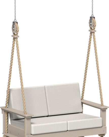 Beige swing with white cushions on a white background