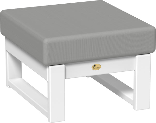 Gray cushioned ottoman with white base on a white background