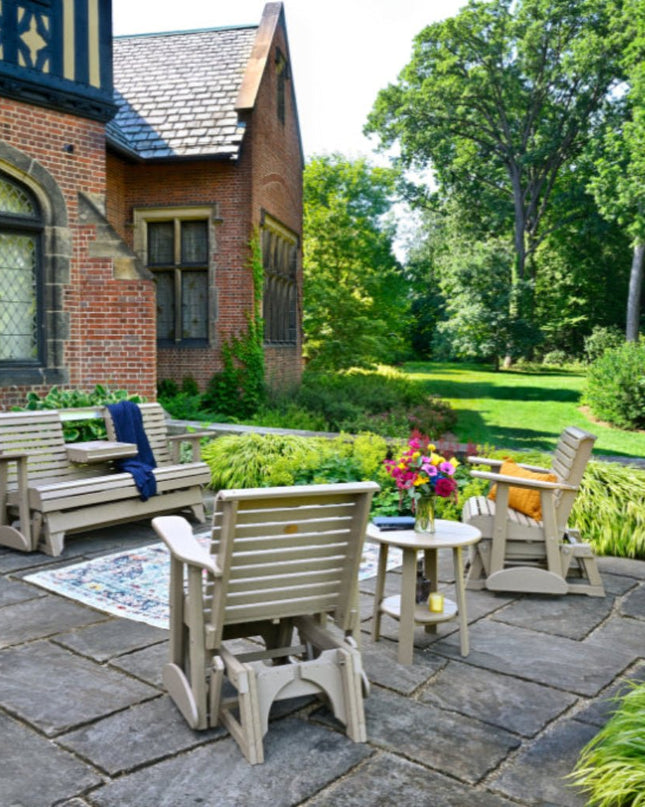 LuxCraft 5 foot plain gliders in weatherwood along side 2 foot plain glider chairs on patio.