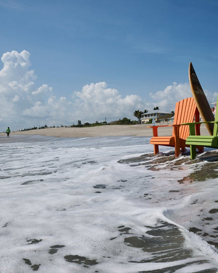 Royal Adirondack chairs in the surf on the beach